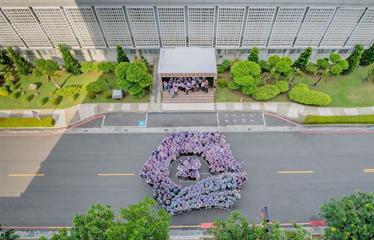 About 400 people gathered in a pop-up event in front of the administrative building to display the bureau emblem.